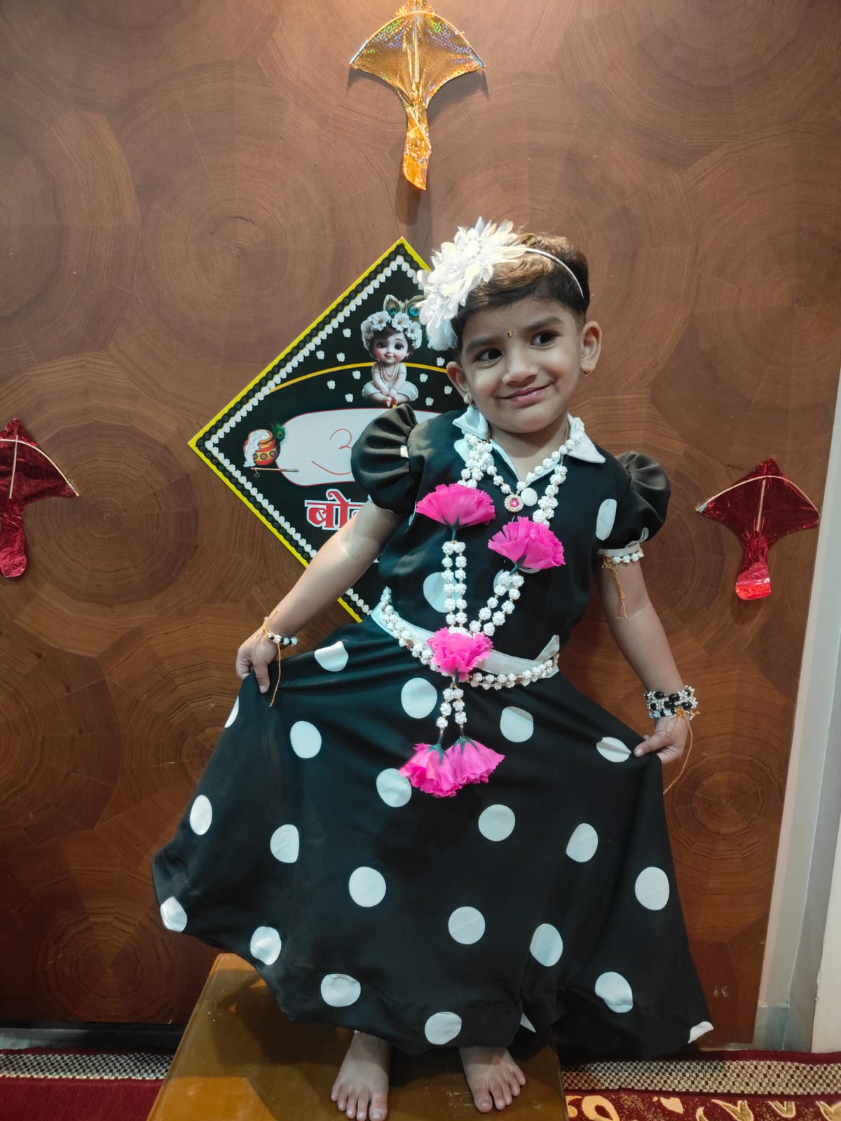 Young girl in a black polka-dot parkar-polka ghagra choli by Anagha Creation